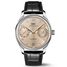 The origins of the Portugieser date back to the late 1930s, when IWC Schaffhausen used a high-precision pocket watch movement to create a distinctively large wristwatch with chronometer precision. First introduced in 2000, the Portugieser Automatic 42 features an open, balanced dial, with a power reserve indicator at 3 o'clock and the small seconds positioned on the opposite side at 9 o'clock. This version features a stainless steel case with a diameter of 42.4 millimeters, a Dune dial, and gold Classic Chronograph Watch In White Gold, Classic Automatic Watch For Anniversary, Classic White Gold Chronograph Watch With Polished Finish, Leather Watch Accessories With Subdials For Anniversary, Classic Chronograph Watch Accessories For Anniversary, Classic Watch With Polished Finish For Anniversary, Classic Watches With Polished Finish For Anniversary, Timeless Chronograph Watch With Polished Finish For Formal Occasions, Timeless Formal Chronograph Watch With Polished Finish