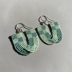 These fun, Mint and Seafoam checkered beaded earrings are hand threaded using 11/0 Miyuki Delica beads and Nymo thread. They are also made with sterling silver wire and earring hooks. These are about 6 cm long with the earring hooks and 3.5 cm wide. All orders include a polishing cloth and a muslin jewelry bag. Earrings are made to order so it can take up to a week or so to make and have shipped out to you. Thank you so much for your patience! All of my art and jewelry are made with so much love Bead Crochet Patterns, Miyuki Delica Beads, Seed Beading, Beaded Jewelry Tutorials, Jewelry Bag, Delica Beads, Bead Crochet, Earring Hooks, Seed Bead Earrings