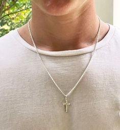 Description This is the perfect, classic sterling silver cross necklace for a man, teenager or even a boy. It is slightly smaller than the Classic Sterling Men's Cross, and is created with clean and simple lines. It features a strong, sterling silver cable chain. Just choose your length. The model is wearing a 20 inch chain. This simple but masculine cross measures 1” x 1/2” and would make a perfect gift for a confirmation, baptism or graduation. It is a classic cross that he will love and be ab Men's Cross Necklace, Mens Cross Necklace Silver, Classic Everyday Cross Pendant Necklace, Everyday Classic Cross Pendant Necklace, Classic Everyday Cross Necklace, Boys Cross Necklace, Confirmation Gifts For Boys, Necklace For Boys, Cross Necklace Men