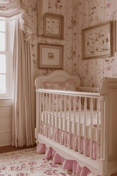 a baby's room with floral wallpaper and white crib in the corner