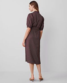 Elevate your wardrobe with the Ann Taylor Dotted Stand Collar Belted Midi Shirtdress, a piece that marries sophistication with comfort. This elegant dress features a unique stand collar and a charming dot pattern, perfect for both office and social gatherings.

- **Size:** Regular - 2
- **Color:** Plum Rose
- **Material:** 100% Polyester
- **Length:** 30" from natural waist; hits at mid-calf
- **Sleeves:** Short sleeves with shirred caps
- **Closure:** Button front placket
- **Features:** Self-t Female Features, Calf Sleeve, Blazer And Skirt, Belted Midi Dress, Sleepwear & Loungewear, Rose Dress, Petite Fashion, Petite Dresses, Tie Belt