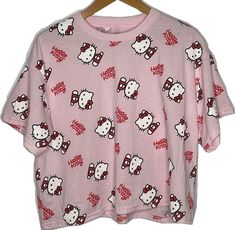 Cute Pink Printed Tops, Cute Printed Pink Top, Hello Kitty Y2k Summer Top, Pink Y2k Style Printed Tops, Kawaii Graphic Print Tops With Relaxed Fit, Pink Y2k Printed Tops, Y2k Pink Printed Tops, Kawaii Relaxed Fit Top With Graphic Print, Kawaii Graphic Print Top With Relaxed Fit