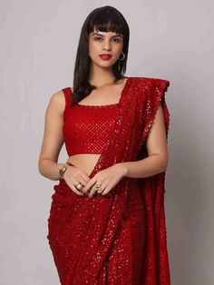 Wear this stunning red sequins georgette cocktail party wear a saree with a blouse and make heads turn at any event. Designed with intricate sequin work and a beautiful sequin floral border, this saree is made from high-quality georgette material that ensures comfort and elegance. The heavy sequin work on both the saree and blouse adds a touch of glamour to your outfit, making it perfect for parties and receptions.
This designer saree comes in a vibrant red color that exudes grace and sophistica One Minute Saree, Desi Attire, Formal Saree, Saree With Belt, Sequin Saree, Floral Print Sarees, Saree Sale, Readymade Saree, Party Wear Saree