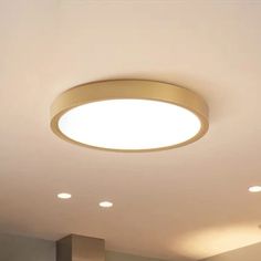 a round light fixture is mounted on the ceiling