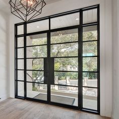 Thermal break iron french double door with sidelight and transom Black Iron Doors Interior, European French Doors, Black Iron Doors, French Doors For Office, French Doors To Office, Doors In Living Room, Door With Sidelights And Transom, Door With Sidelight, Wide French Doors