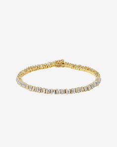 This Classic Diamond Mini Baguette Tennis Bracelet is one of our bestselling styles. We love this piece for its elegance and wear-ability. Beautiful mini baguette diamonds are meticulously set in a vertically staggered setting for a modern feel. Stack it next to one of our bangles for an elevated look. Details 18k rose gold, white gold or yellow gold 2.90 carats of baguette diamonds Bracelet measures 7" inches in length 4mm width Ref: AKB348 Mini Baguette, Diamonds Bracelet, Baguette Diamonds, Tennis Bracelet Diamond, Classic Mini, Baguette Diamond, Tennis Bracelet, White Diamonds, Gold Yellow