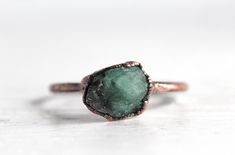 the gold needs a longer production time because I send them out to be plated so if you order the gold I'll change the processing time to 4-6 weeks to allow for that Raw emeralds in your choice of solid copper, silver or heavy gold plate on silver. Please allow differences in the size and color of stones. this listing is for 1 ring Emerald is May's birthstone- sign is Taurus *Legend says that placing emeralds under your tongue gives you the ability to predict the future and offers protection agai Hand Forged Green Emerald Ring As Gift, Hand Forged Green Emerald Ring Gift, Green Copper Rings As Gifts, Hand Forged Green Jewelry For Promise Ring, Raw Emerald Ring, Taurus Jewelry, Silver Emerald Ring, Natural Emerald Rings, Raw Emerald