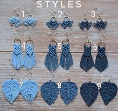 six pairs of tasseled earrings on wooden surface