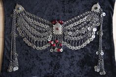 In the Ottoman period, women wore silver jewelry over their fez hats. This product original Ottoman Fez hat jewelry with natural red stones. It is handmade. Elegant Red Ceremonial Headpieces, Handmade Red Festival Headpieces, Red Handmade Festival Headpieces, Handmade Red Headpieces For Festivals, Elegant Silver Necklace For Traditional Ceremonies, Handmade Bohemian Silver Headpiece, Handmade Silver Ceremonial Headpiece, Handmade Silver Headpieces For Ceremonial Occasions, Turkish Jewelry Ottoman