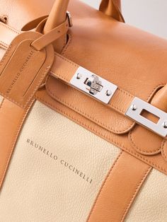 Brunello Cucinelli's weekend bag will make the perfect carry-on, whether you're travelling for business or leisure. It's been made in Italy from panels of full-grain leather and has a twist-lock front flap to keep your luggage secure. Inside, there's space enough for a few outfits, plus any technology you might need. Leather Garment Bag, Porter Bag, Leather Wash Bag, Neutral Accessories, Leather Weekender Bag, White Shoes Sneakers, Leather Duffle Bag, Latest Bags, Leather Duffle