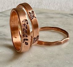 These copper ring sets are modern with a floral design. Each handmade band has been hand stamped and textured individually. Wear them together as a set or alone.  Perfect as thumb or stacking rings.   SIZE The ring bands are 14 gauge copper wire PROCESSING TIME This ring will take 1-3 business days to create and ready to ship.  SHIPPING TIME Your ring will be shipped using USPS first class mail services. It will arrive within 2-6 business days after package is mailed. You will receive your ring in a gift  box ready for gift giving, and bubble wrapped envelope to protect while shipping. RETURN POLICY  I guarantee all my jewelry , so if your not satisfied with your purchase, no worries just contact me within 7 days after purchase and you can ask for a full refund or exchange. Copper Rings Handmade, Ring Stamping, Thumb Rings For Women, Metal Stamping Kit, Bronze Rings, Jewelry Flowers, Gift Flowers, Hand Stamped Ring, Ring Bands