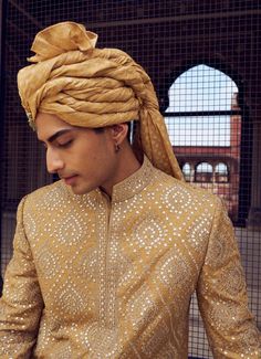 Step into elegance with this gold raw silk short sherwani, adorned with intricate resham and patra work. Paired with a satin kurta and dhoti, it comes with a stole. Festive Naqshi Traditional Dola Silk Wear, Traditional Bandhgala With Intricate Embroidery In Art Silk, Raw Silk Sherwani For Traditional Ceremonies, Raw Silk Straight Kurta Sherwani For Traditional Ceremonies, Traditional Naqshi Drape In Raw Silk, Brocade Sherwani With Naqshi For Diwali, Diwali Brocade Sherwani With Naqshi Details, Bandhgala With Gold Embroidery Straight Kurta For Festivals, Diwali Brocade Sherwani With Naqshi