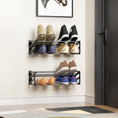 there are several pairs of shoes hanging on the wall