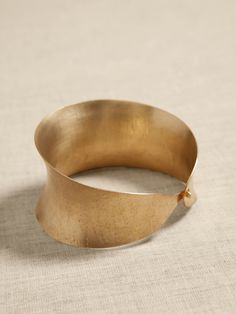 Elegant Brass Cuff Jewelry, Elegant Hand-cast Cuff Jewelry, Formal Hand-forged Bangle Jewelry, Hand Forged Bangle For Formal Occasions, Formal Brass Cuff Jewelry, Formal Hand Forged Bangle Jewelry, Elegant Hammered Brass Bangle, Elegant Bronze Metal Cuff Bracelet, Hand Cast Bronze Bracelet