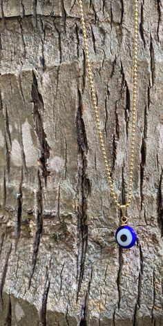 "This necklace is combination of -Handmade Blue Evil Glass bead. -18\" Gold Filled Chain . 🧿The evil eye is a curse or legend believed to be cast by a malevolent glare, usually given to a person when they are unaware. ... Talismans or amulets created to protect against the evil eye are also frequently called \"evil eyes\".🧿" Blue Beaded Chain Charm Necklace As Gift, Blue Beaded Charm Necklaces With Round Beads, Adjustable Blue Chain Necklace As Gift, Adjustable Blue Chain Necklace For Gift, Blue Round Chain Necklace, Blue Beaded Round Pendant Necklace, Blue Beaded Chain Necklace As Gift, Blue Adjustable Chain Necklace As Gift, Gold Beaded Necklaces With Evil Eye For Gifts