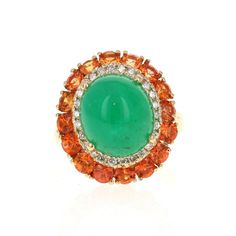 9.04 Carat Emerald Diamond and Orange Sapphire Cocktail Ring!  The most unique ring of all! A beautiful Cabochon Emerald sits in the center of the ring and is surrounded by a cluster of Orange Sapphires and Diamonds.  The carat weight of the stones are as follows:  Emerald = 6.55 carats (measurements of the Emerald are 10mm x 12mm) 16 Orange Sapphires = 2.20 carats 26 Round Cut Diamonds = 0.29 carats (Clarity: SI, Color: F)  The total carat weight of the ring is 9.04 carats.  The ring is set in Yellow Gold Multi-stone Cabochons Fine Jewelry, Yellow Gold Multi-stone Cabochons For Fine Jewelry, Luxury Multi-stone Gemstones For Collectors, Luxury Multi-stone Collectible Gemstones, Luxury Collectible Multi-stone Gemstones, Luxury Emerald Ring With Gemstone Accents, Luxury Multi-stone Oval Cabochons, Collectible Oval Rings With Gemstone Accents, Yellow Gold Multi-stone Cabochons For Gift