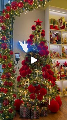 the christmas tree is decorated with red, white and blue balls on it's sides