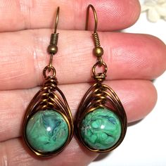 Wire Wrap Earrings Bronze Green Beaded Handmade Dangle Drop Jewlery Gift C315 This Costume Jewelry Beaded Earring Set Is Brand New Nwt And Handmade By Me - Wvluckygirl. Handcrafted With Green Acrylic Beads With A Beautiful Marbling In Black, Blue, Brown And Hints Of White. These Were Wire Wrapped With Brown Bronze Toned Tarnish Resistant Wire To Form A Basket Weave Around The Beads. The Pair Dangle And Drop From French Fishhook Ear Wires For Her Pierced Ears. From Top To Bottom They Measure 1 5/ Wire Wrap Earrings, Vine Jewelry, Peace Earrings, Brown Pearl Earrings, Celtic Knot Earrings, Bronze Green, Costume Jewelry Sets, Beaded Earring, Wrap Earrings