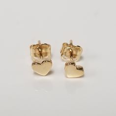 "Thanks for shopping our vintage estate store. We tend to sell well below wholesale and truly hope you enjoy all of our items. Many of the items are one of a kind, so please enjoy scrolling through the pictures and hopefully something will catch your eye. Brown spots are from camera or reflections. Beautiful estate new 14k yellow gold genuine heart studs. Width: 1/4\" 3.5mm Weight: .35 gram Marked 14k and backs are included 14k." 14k Gold Heart Earrings For Mother's Day, Mother's Day 14k Gold Heart Earrings, 14k Yellow Gold Earrings For Birthday, Valentine's Day Gift Yellow Gold Heart Earrings, Gold Earrings For Anniversary On Valentine's Day, Vintage Earrings For Valentine's Day Anniversary, Heart Charm Earrings For Anniversary And Mother's Day, Yellow Gold Heart Earrings For Mother's Day Gift, Vintage Heart Charm Earrings For Anniversary