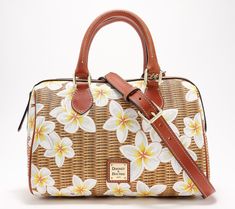 Covered in a fresh, floral design, this coated cotton satchel feels just right for spring. Carry it by the top handles or wear it crossbody with the adjustable strap for hands-free convenience. From Dooney & Bourke. Spring Satchel With Adjustable Handle, Spring Bags With Leather Handles And Coated Canvas, Spring Bag With Leather Handles And Coated Canvas, Spring Satchel With Detachable Strap For Daily Use, Spring Top Handle Satchel With Adjustable Handle, Spring Satchel With Adjustable Handle For On-the-go, Spring Satchel With Adjustable Handle For Daily Use, Floral Print Satchel For Everyday Spring Use, Spring Floral Print Satchel For Everyday Use