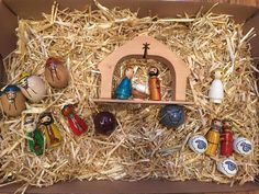 the nativity scene is in a cardboard box