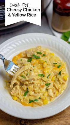 a white plate topped with chicken and yellow rice next to a jar of macaroni and cheese