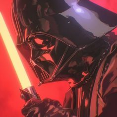 darth vader holding a light saber in his hand