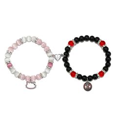 two bracelets with beads and charms on each one is red, white and black