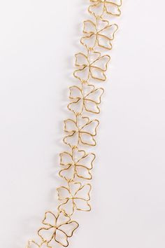 - Let your inner glam girl shine with this adorable necklace! - Gold colored metal material - An interconnected flower design - An adjustable length chain and clasp closure - Size: 13-16 inches Metal Flower Clavicle Chain Necklace, Flower Shaped Metal Clavicle Chain Necklace, Metal Flower Clavicle Necklace, Elegant Metal Necklaces With Flower Shape, Gold Plated Flower Shaped Jewelry For Parties, Gold Necklace 16 Inch For Party, Gold Flower Pendant Chain Jewelry, Gold Jewelry With Flower Pendant Chain, Elegant Gold Metal Flower Necklace