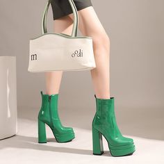 Introducing our newest arrivals ââ‚?the Green Platform Boots! A chic and stylish twist on the classic platform boot. these square-toe beauties are perfect for making a statement. The lush patent leather and chunky block heel add a touch of luxury. while the green hue is perfect for standing out from the crowd. Upper: Patent Leather Lining: Short Plush Outsole: Rubber Toe: Square Toe Closure: Zip Heel: 14cm/5.5'' Platform: 4cm/1.5'' Shaft: 13.5cm/5.3'' Circumference: 25cm/9.8'' Color: Green. Blac Trendy High Heel Platform Boots, Trendy Chunky Platform High Heeled Boots, Trendy High Heeled Boots With Chunky Platform, Trendy Heeled Boots With Chunky Platform, Chunky Platform Heeled Boots For Fall, Chunky Platform High Heel Boots In Polyurethane, Trendy Chunky Platform High Ankle Heels, Fall Chunky Platform Boots In Polyurethane, Retro High Heel Boots For Spring