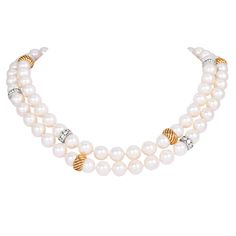 1960s Diamond Pearl 18K Gold Long Statement Necklace is a stunning example of vintage luxury. Crafted in a mix of 18K white and yellow gold, the necklace features lustrous 9mm pearls, which are beautifully complemented by channel-set diamond sliders in white gold and grooved yellow gold beads. The 9mm Lustrous Akoya White pearl with pink overtone necklace showcases approximately 7.50 carats of round brilliant diamonds, graded H-I in color and VS-SI in clarity, adding a brilliant sparkle to the piece. The design is completed with a statement diamond-set ball clasp with an insert hook, providing both security and elegance. This long, graceful necklace is perfect for special occasions, black-tie events, or as a timeless addition to any fine jewelry collection.  This can be worn as a long stra Luxury Yellow Gold Diamond Pearl Necklace, Exquisite Luxury Yellow Gold Pearl Necklace, Luxury Multi-strand Pearl Pendant Jewelry, Luxury Multi-strand Pearl Necklace With Pearl Chain, Luxury Pearl White Multi-strand Necklace, Long Statement Necklace, Black Tie Event, Fine Jewelry Collection, Wedding Jewellery Necklace