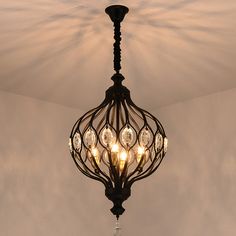 a chandelier hanging from the ceiling in a room