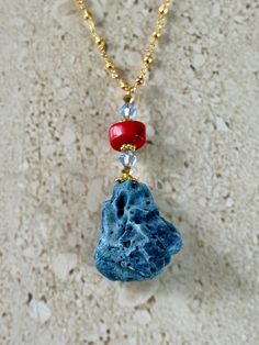 Natural Blue Coral pendant accented with a red coral rondelle shape bead and 6MM light sapphire blue Swarovski crystal and gold pyrite rosary chain.  Handmade GIFT BOXED Blue Gemstone Jewelry For The Beach, Red Faceted Beads Jewelry For Beach, Faceted Red Coral Beads Jewelry Gift, Beach Jewelry With Red Gemstone Beads, Beach Red Gemstone Beads Jewelry, Red Gemstone Beads Jewelry For Beach, Coral Faceted Beads Jewelry As Gift, Coral Faceted Beads Jewelry For Gifts, Red Gemstone Bead Jewelry For The Beach