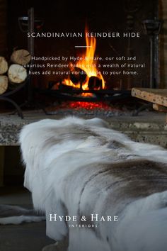 an image of a fireplace with logs in the background and text that reads scandinavian reindeer hide