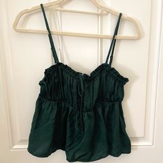 Deep Emerald Green Camisole Top With Adjustable Spaghetti Straps. Size Small, Never Worn. Bow Detail On Front. Forest Green Tops, Green Tank Strap Camisole For Spring, Green Camisole With Tank Straps For Spring, Green Cotton Camisole With Tank Straps, Green Vacation Top With Built-in Bra, Green Cotton Camisole For Vacation, Green Cotton Camisole Crop Top, Green Cotton Tank Top With Built-in Bra, Green Tank Style Trendy Camisole