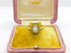 Details: A fantastic and wonderfully designed antique Victorian 18ct yellow gold floral cluster ring set with cabochon opal surrounded by diamonds hallmarked to the interior c1890, the stones have been tested. This is a wonderful item that would make a perfect gift or addition to any collection. The BOX pictured is for PRESENTATION ONLY and is NOT included in the listings but used to frame the pictures unless specifically stated otherwise.  Condition Report: The item is in good condition, all ou Antique Style Opal Ring For Formal Occasions, Heirloom Gold Opal Cabochon Ring, Heirloom Gold Opal Ring With Cabochon, Victorian Yellow Gold Opal Cabochon Ring, Victorian Yellow Gold Opal Ring With Cabochon, Victorian Style Formal Opal Ring, Victorian 14k Gold Cabochon Opal Ring, Vintage Gold Opal Cabochon Ring, Vintage Opal Rings In Yellow Gold