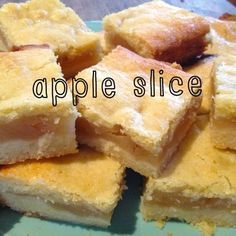 several pieces of cake sitting on top of a blue plate with the words apple slice above it