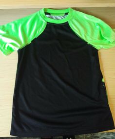 This listing is for a new with tags (unworn, no tips, stains, or tears) Unisex SZ  4/5 PERFORMANCE SHIRT SHORT SLEEVE BLACK WITH NEON GREEN GEOGRAPHIC PATTERN New with tags. Never worn. Comes from a smoke & pet free home. Check out my other items! FOR MORE APPAREL, COMICS, SOCKS, JUST ABOUT ANYTHING!!! Black Athleisure T-shirt For Summer, Black Breathable T-shirt For Summer, Green Moisture-wicking T-shirt With Crew Neck, Green Sportswear T-shirt For Summer, Green Athleisure T-shirt For Workout, Fitted Black Sporty T-shirt, Black Summer Training T-shirt, Green Workout T-shirt Short Sleeve, Black Fitted T-shirt For Sports Season