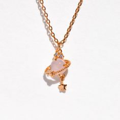 You'll have drops of Jupiter in your hair while wearing this beautiful necklace! Shop this best selling design now. Rose Gold Crystal Necklace With Clavicle Chain, Rose Gold Clavicle Chain Crystal Necklace, Adjustable Cute Charm Necklaces, Trendy Crystal Clavicle Chain Necklace For Gifts, Cute Gold Dangle Necklaces, Feminine Pendant Charm Necklace With Delicate Chain, Trendy Pendant Charm Necklace For Her, Trendy Pendant Charm Necklaces For Her, Cute Pendant Jewelry Gift For Her