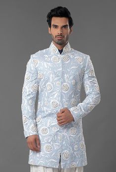 Light Blue Embroidered Sherwani Designer Blue Kurta With Intricate Embroidery, Blue Chikankari Embroidered Nehru Jacket For Reception, Designer Transitional Sherwani With Floral Embroidery, Designer Sherwani With Floral Embroidery For Eid, Blue Floral Embroidery Kurta For Reception, Blue Floral Embroidered Kurta For Reception, Designer Blue Nehru Jacket With Intricate Embroidery, Designer Blue Traditional Wear With Resham Embroidery, Blue Raw Silk Bandhgala For Designer Wear