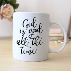 a white coffee mug with the words god is good all the time