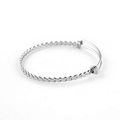 Quantity: 50 pieces per lot  Material: High quality Stainless Steel with high quality polishing process to achieve smooth and shiny appearance Color: Dark Silver tone Stainless Steel Base Color Dimension:  - Bangle Width :  About 3.8 mm - Bangle Sizes : 60 mm / 2.4 inches for Regular women wrist Perfect Gift for any occasion. You can add it as one of the stackable bracelets to mix and match other design of bracelets. Add your own charms to create unique theme or story for these bangles bracelets. It would be a great gift to anyone who is your special on. OR just simply wear single pieces or multiple pieces of these plain cable twist bangles on their own preference. Wire Bangle Bracelets, Twisted Bangle, Wire Bangles, Stackable Bracelets, Cuff Bangles, Stainless Steel Jewelry, Charm Jewelry, Bracelets For Men, Gifts For Family