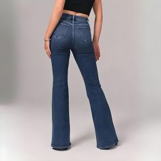 FLARE UP YOUR STYLE WITH HIGH RISE STRETCH JEAN! A Timeless Style : Flared Jean✨ Embrace a timeless style that effortlessly combines retro vibes with modern trends. Our high-rise flared jeans are designed to flatter your figure and elongate your legs. With our '70s-inspired washes and finishes, you can achieve a vintage look that never goes out of style. Slimming Fit On-trend High Rise Flare Jeans have the ideal slimming fit — offers a flattering silhouette from the waist down in a full-length f Modern High Waist Rigid Denim Flare Jeans, Blue High Waist Rigid Denim Flare Jeans, Casual Full-length Rigid Denim Flare Jeans, Modern High-waisted Rigid Denim Flare Jeans, Stretch Denim Blue Full-length Flares, Flower Slippers, Walking Women, Comfortable Jeans, Walking Sandals