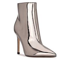 Update your ensemble with extra edge by donning these booties featuring a metallic upper and set on a sky-high stiletto heel. From Nine West. Elegant Metallic Boots With Pointed Toe, Luxury Metallic Boots With Pointed Toe, Luxury Metallic Pointed Toe Boots, Elegant Metallic High Heeled Boots, Luxury High Heel Metallic Boots, Chic Metallic Heeled Boots For Formal Occasions, Luxury Metallic High Heel Boots, Chic Metallic Boots For Formal Occasions, Chic Silver Heels For Fall