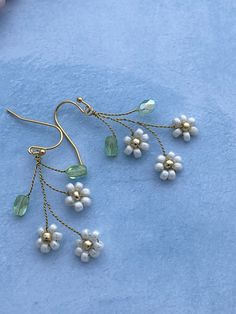 Branch earrings, Floral earrings, daisy earrings, floral earrings, flowers earrings, long floral earrings, bohemian earrings, dangle flowers earrings, Boho earrings. Nature inspired long earrings on twisted wire with beautiful beaded small glass flowers and greenery beads. Feminine and delicate looking floral earrings made with twisted wire, Czech Glass beads and ended with matching hooks. Unique and special gold green white colors combination and shape makes these earrings special, original, on Delicate Flower Charm Earrings For Spring, Handmade Floral Drop Earrings For Spring, Handmade Flower Dangle Earrings For Spring, Spring Handmade Flower Dangle Earrings, Flower-shaped Jewelry With Matching Earrings For Spring, Spring Handmade Flower Dangle Jewelry, Whimsical Flower Jewelry For Spring, Whimsical Flower-shaped Spring Jewelry, Dainty Adjustable Flower Earrings For Spring