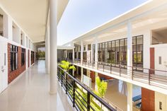 an empty building with lots of windows and balconies