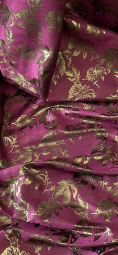 purple and gold fabric with flowers on it