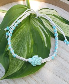 These sea turtle anklets are the ultimate beach accessory this summer! Available in other colors. Click link below: https://www.etsy.com/listing/1479950123 These anklets are handwoven with very strong yet soft cotton string. It features a ceramic sea turtle in the center of the anklet along with seed beads that compliment the turtle as accent beads. There are 5 different colors to choose from. This makes a great accessory to your beach outfit. And it also makes a very lovely gift for any ocea Turtle Anklet, Sea Turtle Gifts, Surfer Jewelry, Summer Anklets, Turtle Gifts, Cotton String, Beach Lover, Protection Bracelet, Ankle Bracelet