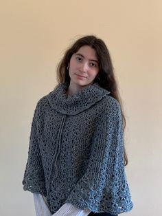 "*READY TO SHIP* This is a unique handmade, gray, crocheted poncho for the Fall/Winter season. It is very soft comfortable! Perfect to use for a fashionable outfit for going out. The neck portion is meant to be folded as shown in the images. Only ONE available.  Yarn used is 80% acrylic and 20% cotton. Model shown is 5'9\" and wears size medium. Handwash and natural dry only. Made in smoke free home. Just message me for any questions you may have. Check out my shop for other handmade, crocheted attire!" Fall Crochet Poncho One Size, Gray Shawl Poncho For Winter, Gray Winter Shawl Poncho, Oversized Crochet Poncho For Winter, Casual Hand Knitted Poncho For Fall, Gray Oversized Poncho For Winter, Oversized Gray Poncho For Winter, Fall Crochet Poncho Made Of Yarn, Winter Crochet Yarn Poncho