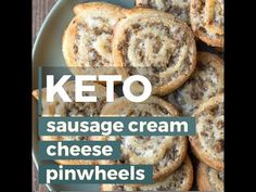 keto sausage cream cheese pinwheels on a plate with the words keto